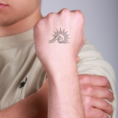 tatouage ephemere vague grand soleil style oceanique et lumineux