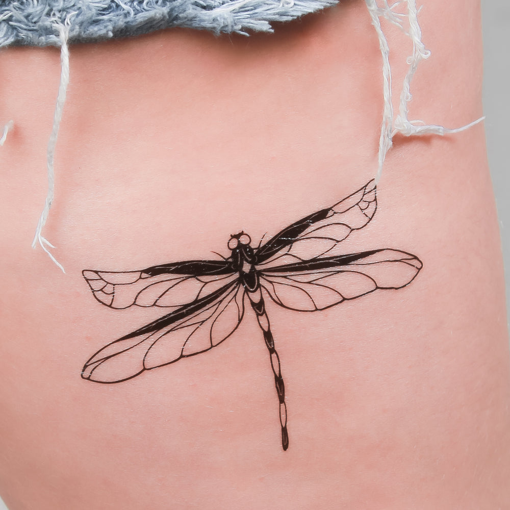 simple black dragonfly tattoo