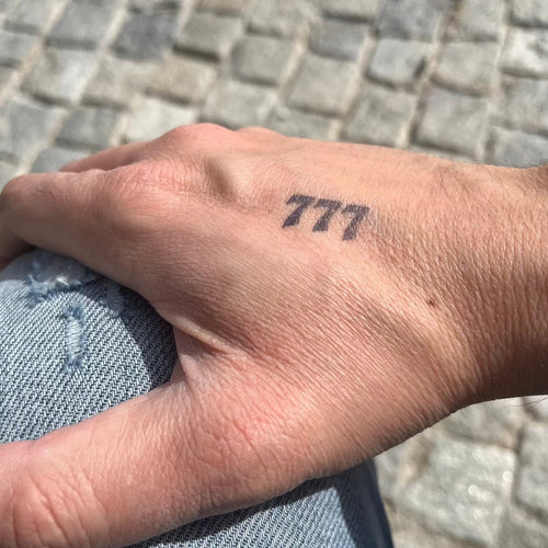777 tattoo